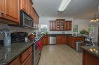 Big cook's kitchen! Lots of cabinets and work tops, as well as an eat in nook and separate pantry.