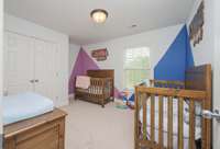 Bedroom 2 with generous floor and closet space.