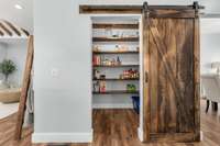 A practical walk in pantry offers space to store everything from your family's favorite snacks to the nutritious staples that keep your home going. Keep your kitchen clutter-free by retiring unsightly kitchen appliances to their designated shelving.