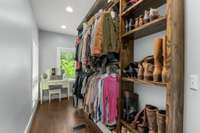 The primary bedroom also features impressive his-and-hers closets with custom built shelving to yield a variety of options for your wardrobe. An abundance of natural light makes mixing and matching your favorite pieces for your next look a breeze.