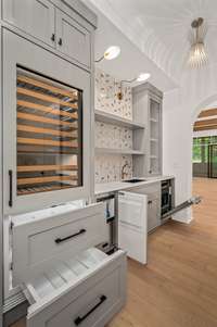 Butler Pantry is the best serving prep/clean up center. Housing sub-zero drawers,wine/ beverage cooler, ice maker, deep sink and full size dishwasher. Plus Plenty of cabinets add to your storage  space