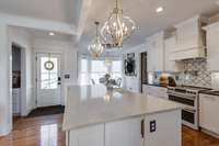 Full View of Kitchen Cabinetry with Backsplash