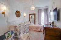 GUEST HOUSE ROOM WITH BEAUTIFUL LIGHTING AND WOOD TRIM DETAILS