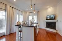 GUEST HOUSE KITCHEN ISLAND WITH WOOD FLOORS AND FIREPLACE