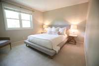 One of the spacious bedrooms with brand new carpet