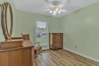 Third bedroom on main level with ceiling fan