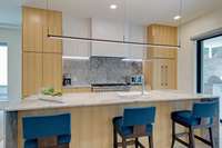 Marble backsplash, custom under cabinet lighting, + pantry