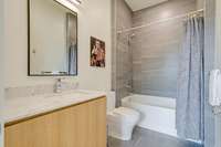 Full en-suite bathroom off of bedroom 2 w/tiled shower-tub