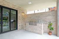 Built-in gas grill + outdoor kitchen area