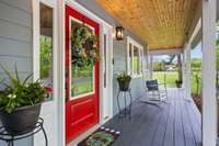 The wraparound and screened porch is constructed of Trex composite decking.