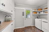 New cabinets and shelving were added to the mudroom/laundry room in 2023.