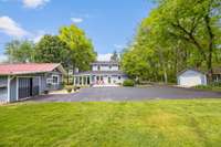 This is the view of the back side of the house including the detached two car garage, guest house and workshop.