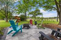 This hardscape patio is right outside of the screened porch and features the hangout for those late night bonfires.