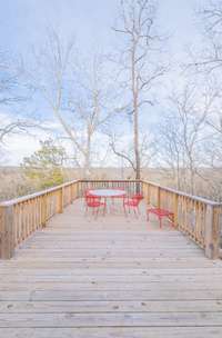 Large back deck overlooking spring creek