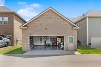 2-car garage, custom finished Epoxy floors, custom built storage bins / containers, added gas heater for added comfort/protection & colder months. Extra full size frig stays.