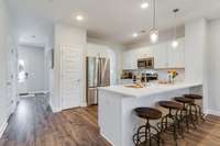 White Kitchen, Stainless Appliances and Upgraded Back Splash!