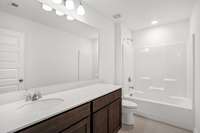 Sample Photo. Not the subject property. Subject property has double sinks in guest bath.