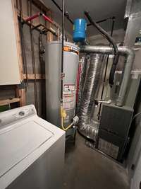 In the laundry/mechanical room I want you to see the new(er) water heater and the Trane gas furnace.  The washer and dryer can stay or go!