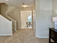 From the bay window looking through to the kitchen and the dining.  Powder room on the right there.