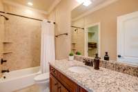 This large bathroom could easily be turned into a jack and jill bath with the addition of a barn door to to hall providing access for a 5th bedroom.