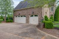 Three car garage with extra parking pad provides ample parking for you and your guest.