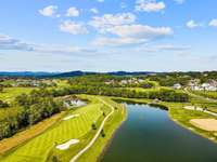 Birdseye view of the 5th hole and pond behind the house.