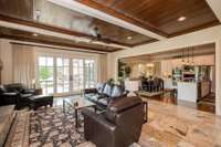 Cozy up in the fireside keeping room complemented by 16x16 travertine tile floors and cypress wood ceilings. Step outside to discover a built-in gas grill, manicured flat backyard and breathtaking views of the 5th hole and golf course pond.