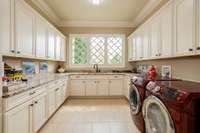 Extra large laundry room conveniently located next to the kitchen and at the bottom of the stairs almost takes the work out of doing the laundry--almost!