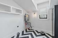 Laundry Room Upstairs with Wine Refrigerator and Tankless Hot Water Heater