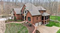 So many architectural elements to this home. 2.5 car garages below. One feeds privately into in-law suite…no steps in! 2 more garages on upper floor entry. Convenience for everyone!