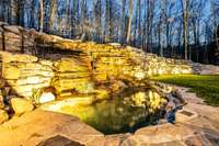 Natural retention 'pool' for waterfall runoff.  Water is supplied by well on property...no need to pay an extra on your water bill.