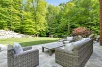 Gorgeous flat stone back lanai with views of the gorgeous and massive maples, hickories and other beautiful Tenneessee native trees. Great shade from home in the afternoon hours...no need for trellis-just wide open views!