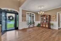 Formal dining room overlooking front of home.  Solid sand and finish hardwood floors