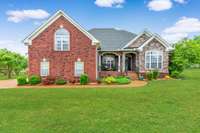 Only a few steps into this all brick and stone exterior one owner home!