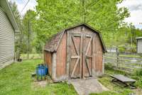 Storage shed on side of home