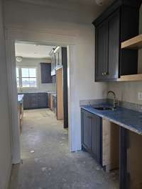 Butler's pantry will have ice machine,  there will be room for wine fridge, wood cabinets in pantry