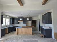 Large beautiful kitchen withisland and granitr