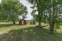 Storage buildings stay with the property. Red building has electricity.