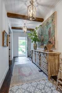 Details make all the difference! Stunning and welcoming entry with inset tile floor.