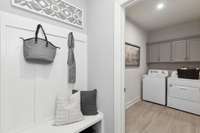 Oversized walk-in laundry room & valet area off of garage entry.