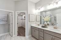 Owner's oasis with double vanities, ceramic tile, and choice of shower and tub or walk-in shower only at NO cost.