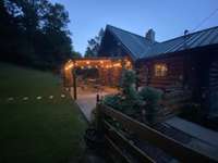 Night view of the "party pad" - birds are frequent to the feeder and the clematis comes up on it's own every year.