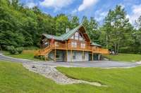 12.2 acres in a private setting with freshly stained front deck