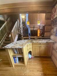 View of the bar area and fur baby cutout in the cabinet