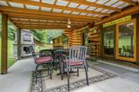 Welcome to the party pad at little pond creek road.  The outdoor fireplace is perfect for all seasons.  Plus it's nice to get rid of yard guff.