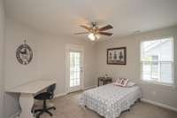 Another wonderful bedroom with access to an upstairs covered porch.