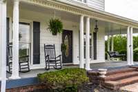 This front porch  with rocking chairs and porch swing are the things we dream about!