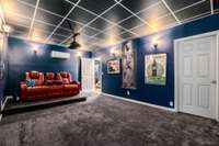 The dark paint is ideal for a theater room.  Carpet helps with the sound.