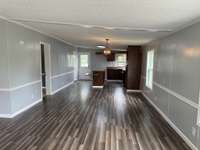 A view of dining room and kitchen