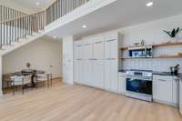 Custom wine room is hidden behind the cabinet doors.